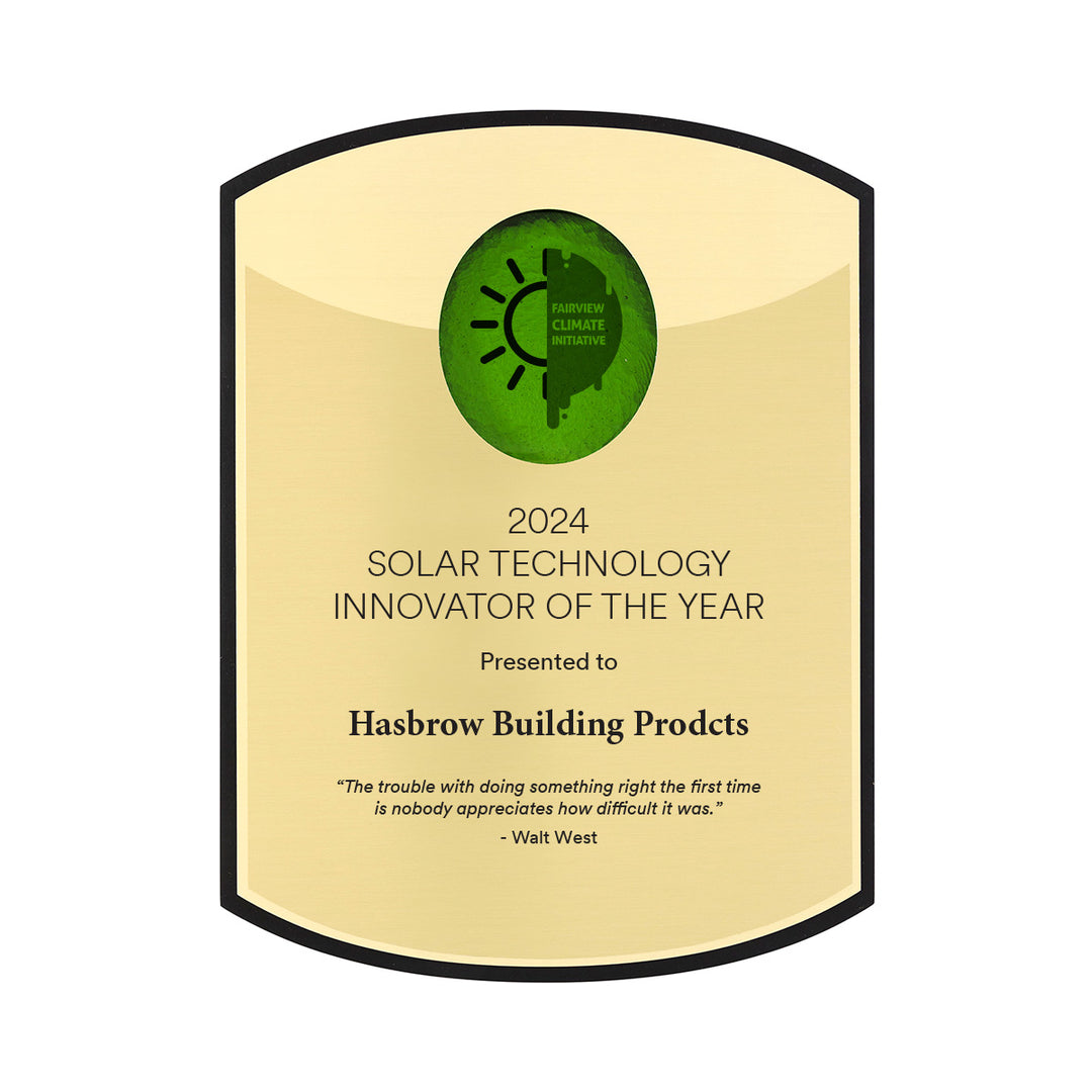 Recycled black plaque curved at top and bottom with logo under green glass. Gold plates with black text.