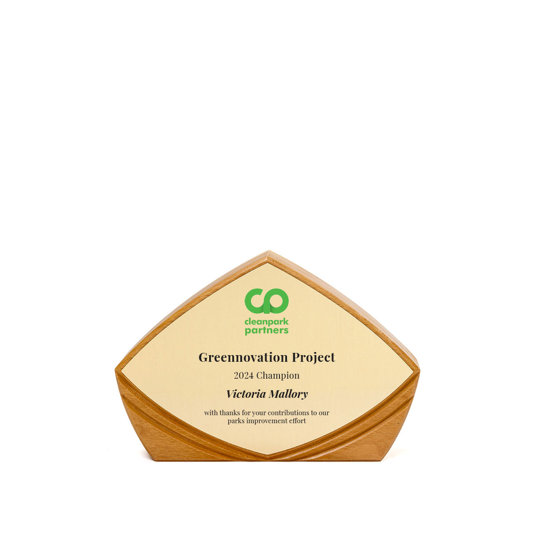 FSC-certified cherry Flight award, wing-shaped, with a gently curved gold plate | designed by Rivanna.