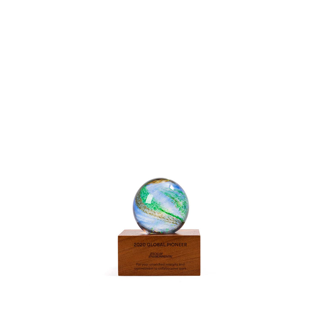 Handcrafted Blue Planet artisan glass award with swirling earth tones, mounted on a FSC-certified wood base. This original Rivanna design is made in the USA. A unique recognition award ideal for environmental leadership or global impact. Personalization available.