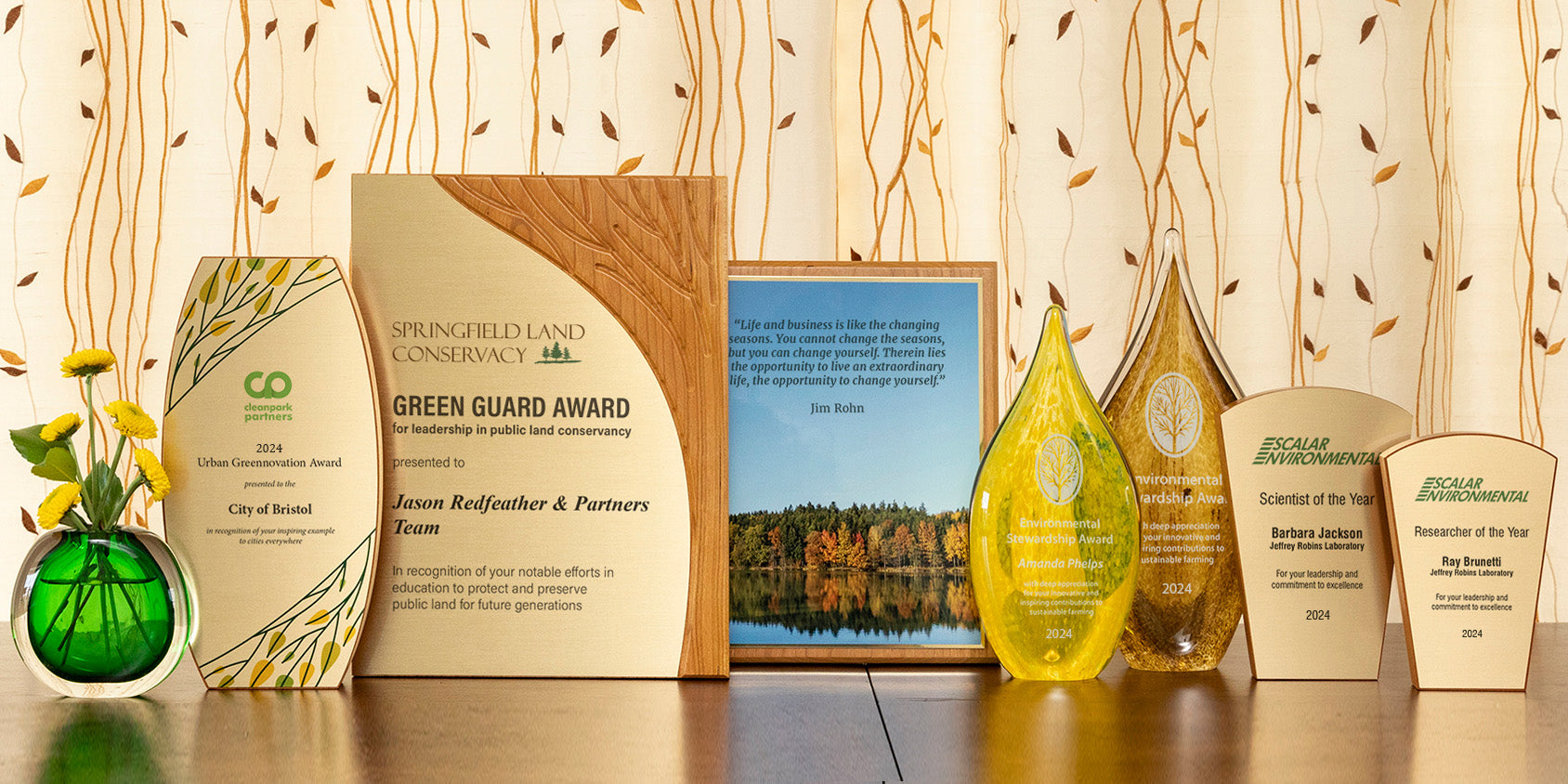 Sustainable corporate awards made from eco-friendly materials including wood and glass