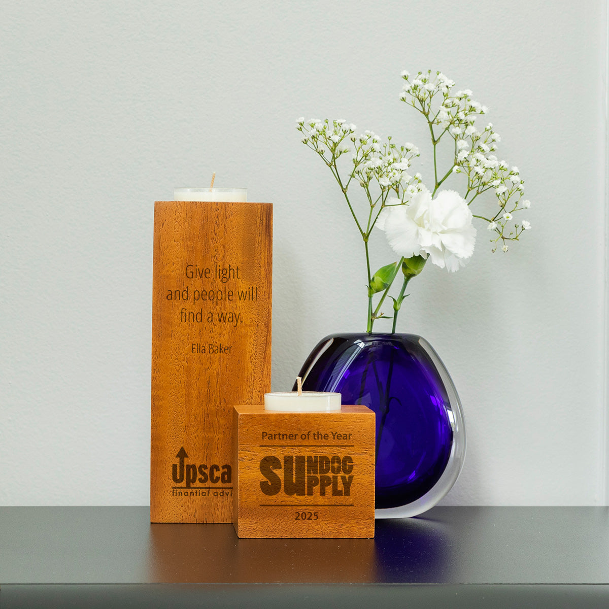 Sustainable wooden candle holders and artisan glass for eco-conscious corporate gifting