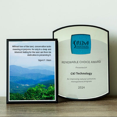Black wall plaques made with recycled materials, a photo plaque with a shot of the blue ridge and a silver personalized plaque with blue glass