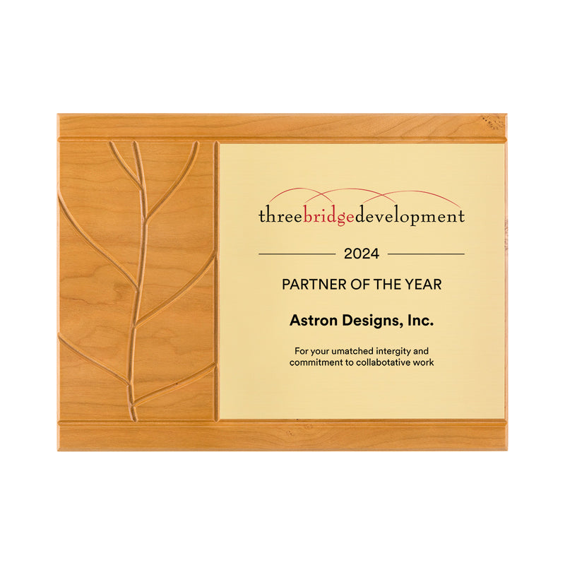 Sustainable cherry plaque with carved leaf shape and gold engraving plate.