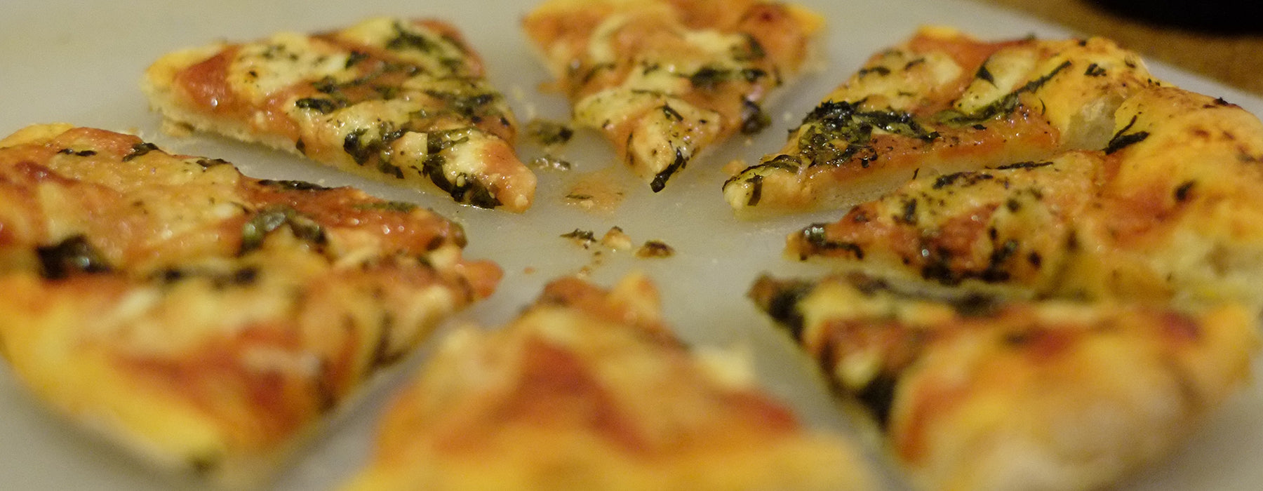Freshly sliced margherita pizza—a Rivanna team favorite for staff celebrations and meetings.