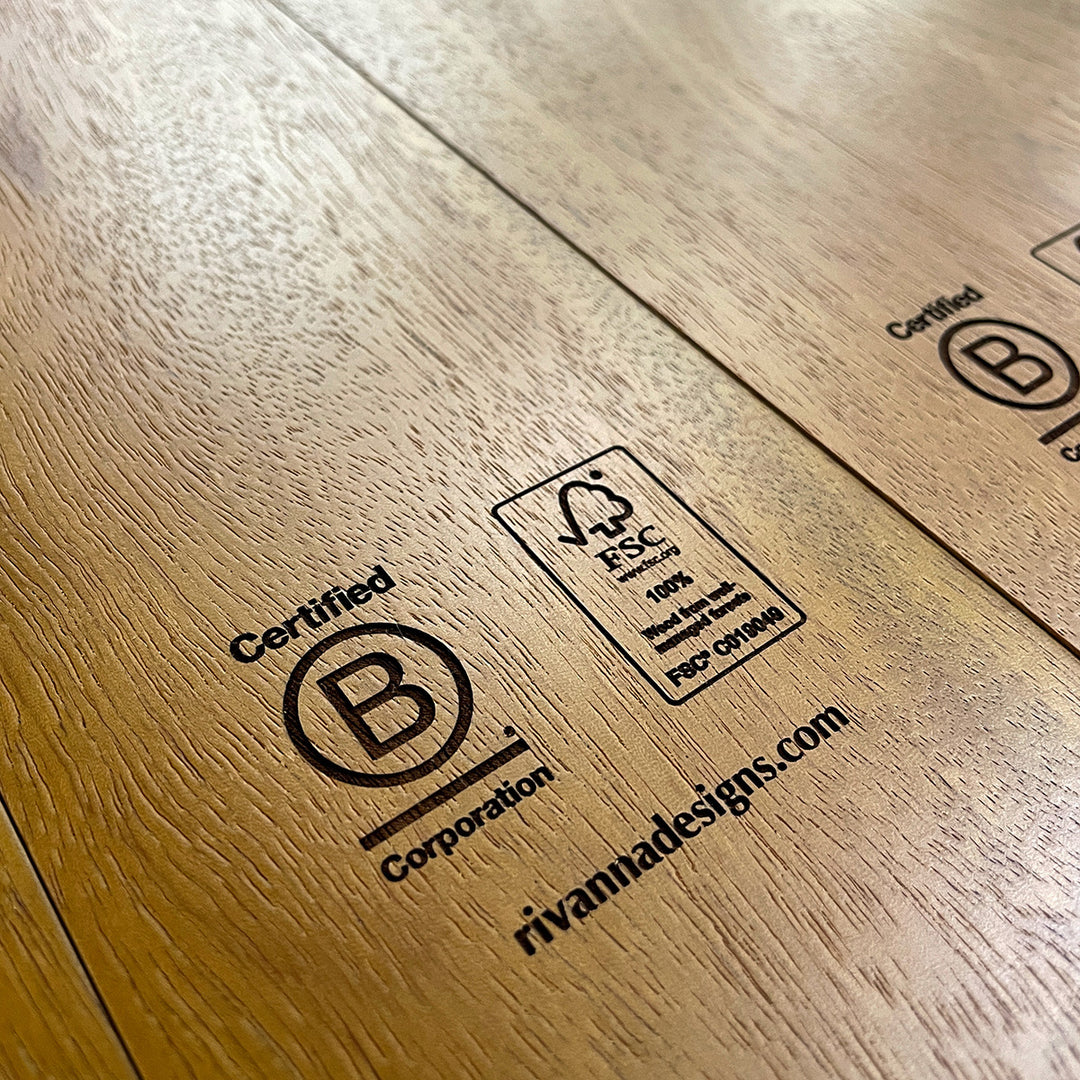 FSC and B Corp certification logos engraved on finished FSC-certified wood plaques made by Rivanna.