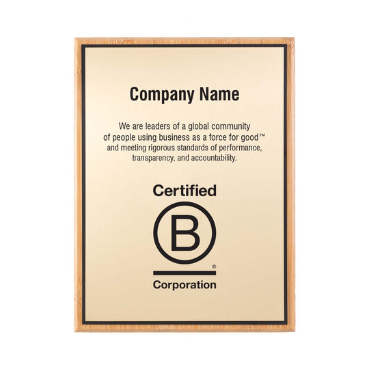 Customizable gold B Corp plaque with bamboo backer, engraved logo, and space for company name and mission text.