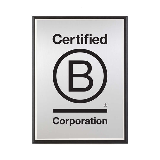 Brushed silver Certified B Corporation plaque with bold logo, mounted on recycled black Richlite.